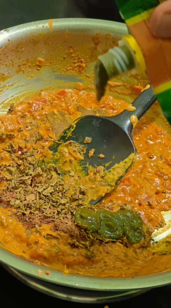 Kasuri methi, green chutney, and coriander mint chutney added to the gravy