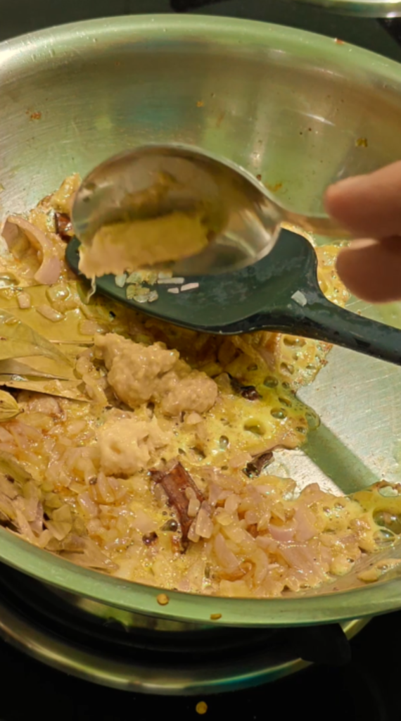 Ginger-garlic paste spooned onto sautéed onions