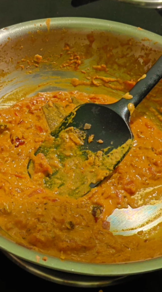 Thick onion and tomato masala cooked down in the pan
