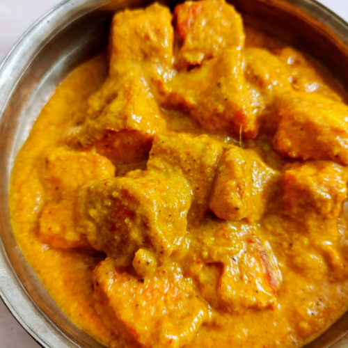 closeup shot of Paneer Butter Masala / Butter Paneer