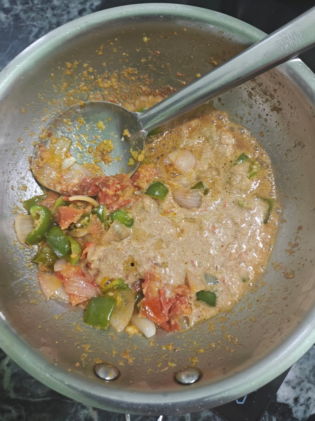Blended vegetable paste added back to the sautéed vegetables in the pan